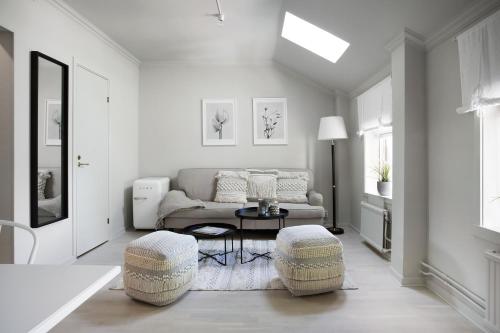 a living room with a couch and a table at WOW, Föreningsgatan 9 in Gothenburg