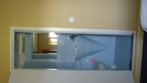 a mirror on the wall of a bathroom at Auberge de Marville in Marville