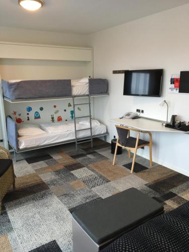Voodi või voodid majutusasutuse Hotel Skivehus toas