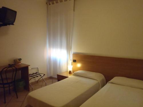 Cama o camas de una habitación en Albergo Pizzeria Sole