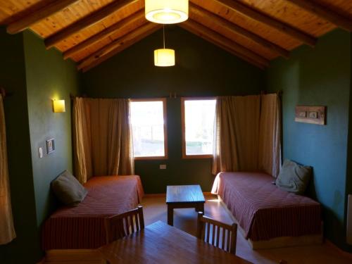 Voodi või voodid majutusasutuse Cabañas Monte Coiron toas