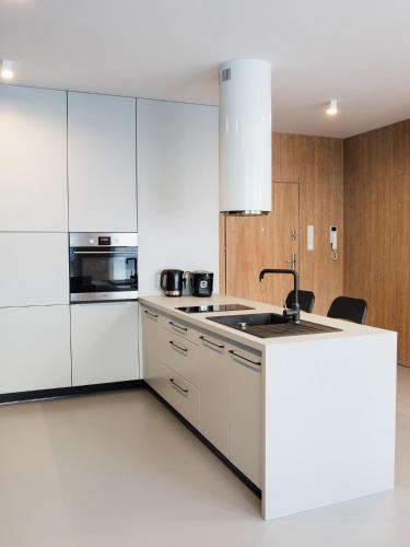 Η κουζίνα ή μικρή κουζίνα στο Ataner Apartamenty