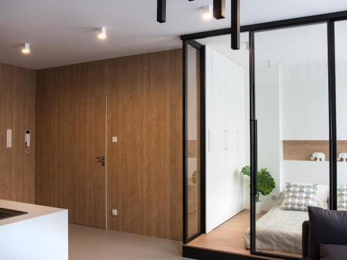 Ένα ή περισσότερα κρεβάτια σε δωμάτιο στο Ataner Apartamenty