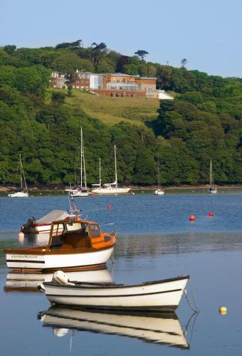 a boat sitting in the water on a lake at Kinsale Hotel & Spa in Kinsale