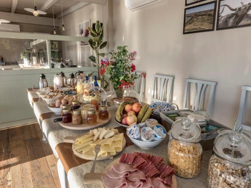 a long table with many different types of food on it at Agriturismo La Forra in Cavriglia