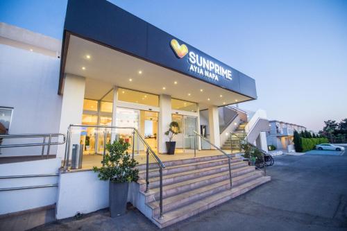 a store with stairs in front of a building at Sunprime Ayia Napa Suites - Adults Only in Ayia Napa
