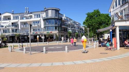 a person on a scooter in the middle of a street at Villa Meeresrauschen, Ostseeperle in Pelzerhaken