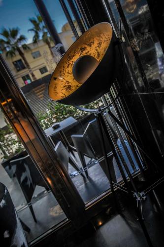 a close up of a light hanging from a ceiling at H Hotel & SPA - Adults Only in St Julian's