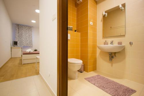 a bathroom with a toilet and a sink at Apartment Luka in Split