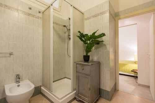 a bathroom with a shower and a toilet and a sink at Lovely New home, Trastevere! in Rome