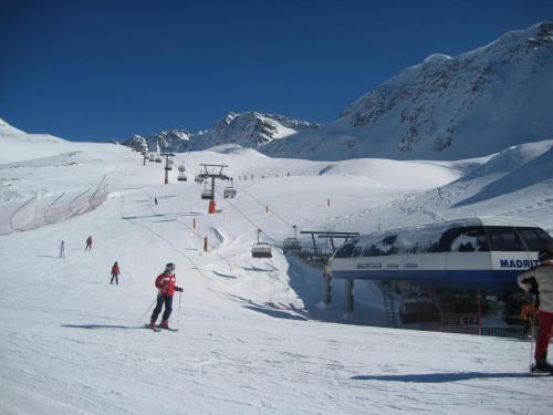 a group of people skiing on a ski slope at Alpina Residence in Solda
