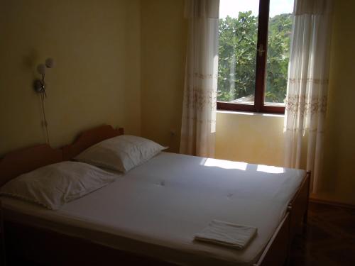 Postel nebo postele na pokoji v ubytování Apartments Ariana