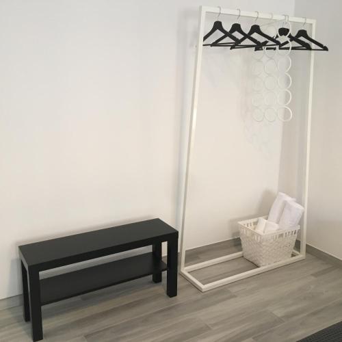 a room with a table and a mirror at Four Rooms in Bologna