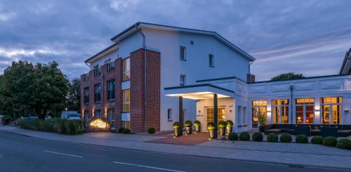 a building on the side of a street at Hotel Restaurant Burg-Klause in Burg auf Fehmarn