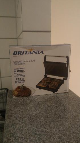 a box sitting on top of a counter with a box of food at Apart Hotel Quartier Latin in Vitória