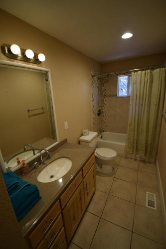 a bathroom with a sink and a toilet at Mountain Place in Groveland
