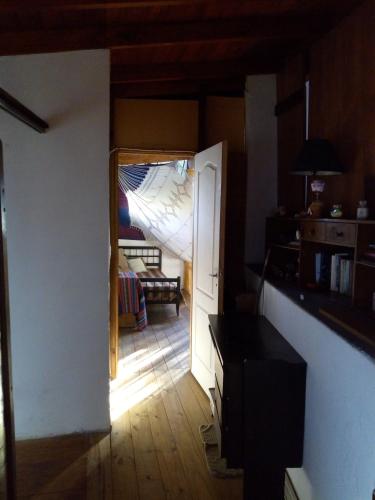 a room with an open door to a living room at Bicicleteria Don Perez in San Isidro