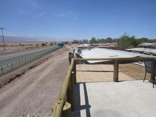 a fence on the side of a road at Hostal Alabalti in San Pedro de Atacama