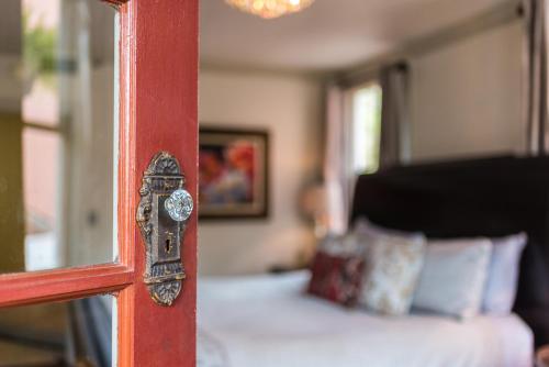 a mirror on the wall of a bedroom at 44 Spanish Street Inn (Adults only) in St. Augustine