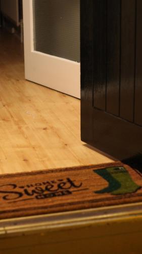 a rug on a floor next to a door at Wayside in Tandragee