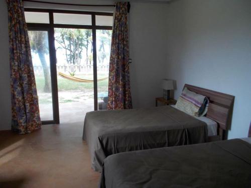 Ένα ή περισσότερα κρεβάτια σε δωμάτιο στο Gravier beach house