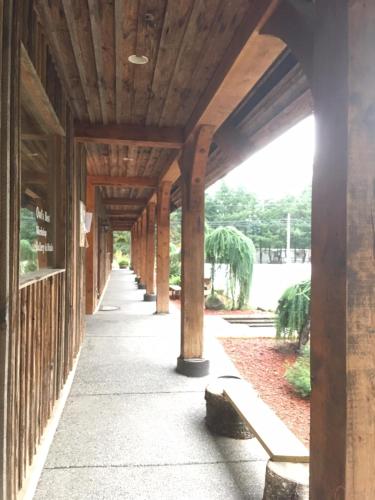 a covered walkway in a building with columns at Owl Street Lodge in Hope
