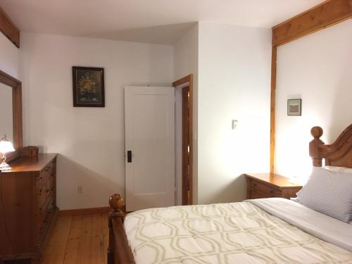 a bedroom with a large bed and a window at Owl Street Lodge in Hope