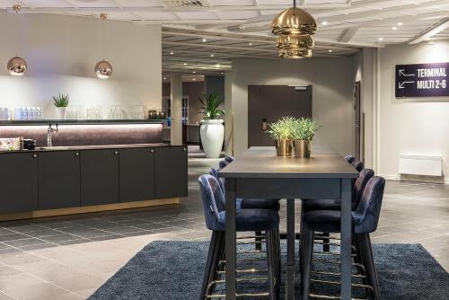 a conference room with a table and chairs at Clarion Hotel Oslo Airport in Gardermoen