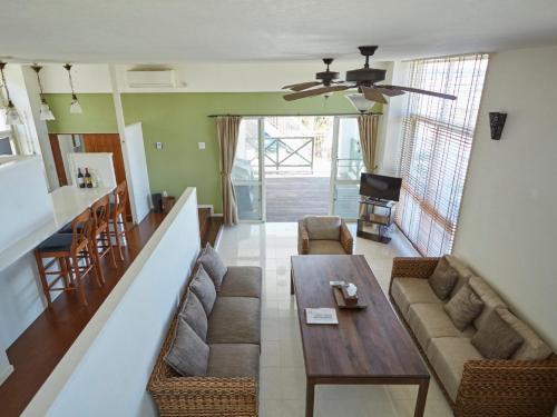 a living room with a couch and a table at T&T MOF-Maeda Ocean Front House- in Onna