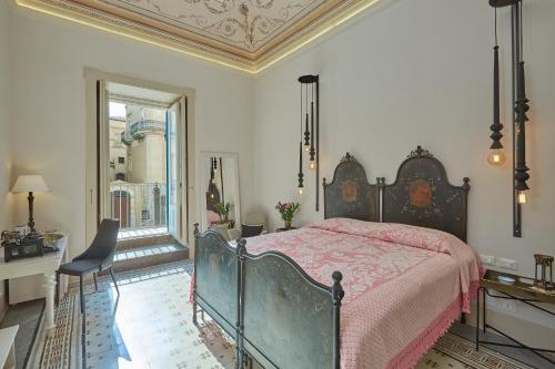 Ένα ή περισσότερα κρεβάτια σε δωμάτιο στο Piazza Duomo 36