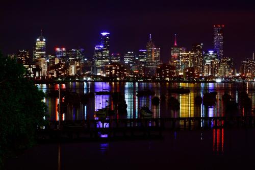 a view of a city skyline at night at Captains Retreat Apartments and Cottages in Williamstown