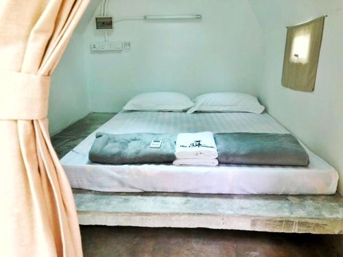 a large bed in a room with at Eco Capsule Resort at Teluk Bahang, Penang in Batu Ferringhi