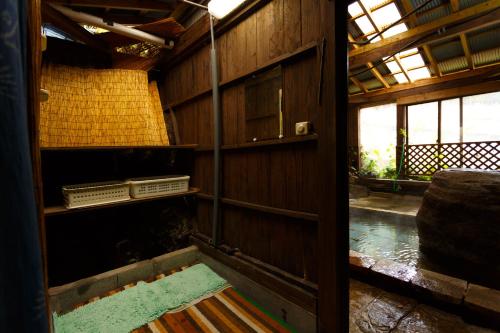 an inside view of a building with a room with water at Yufuin Inakamura Inakaso in Yufuin