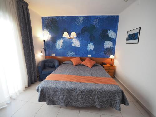 Ένα ή περισσότερα κρεβάτια σε δωμάτιο στο Hotel Montserrat