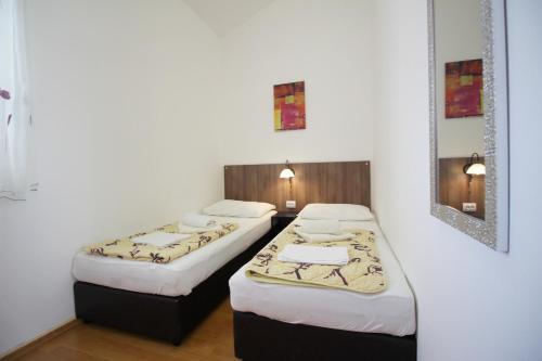 Posteľ alebo postele v izbe v ubytovaní Apartment Pintar Beach