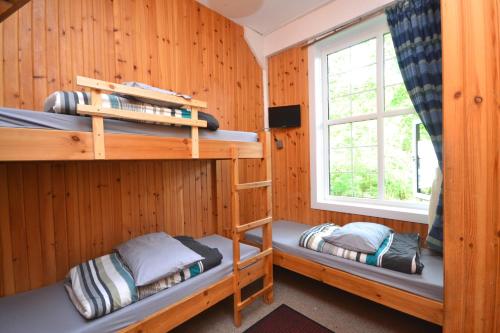 Postel nebo postele na pokoji v ubytování Blackwater Hostel