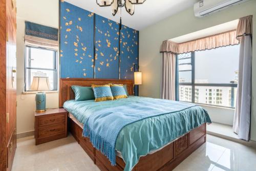 Llit o llits en una habitació de Haikou Meilan·Hainan Univeristy· Locals Apartment 00141450