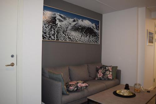 a living room with a couch and a table at Abisko Hostel in Abisko