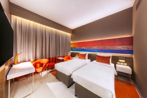 Кровать или кровати в номере Citymax Hotel Ras Al Khaimah
