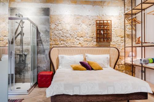 Ένα ή περισσότερα κρεβάτια σε δωμάτιο στο TasEV Guesthouse