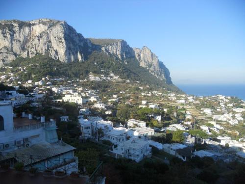 a view of a city with a mountain in the background at Da Gelsomina in Anacapri