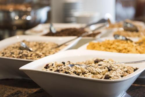 three bowls of food sitting on a table at Sepp & Hannis Suiten im Dorf in Neustift im Stubaital