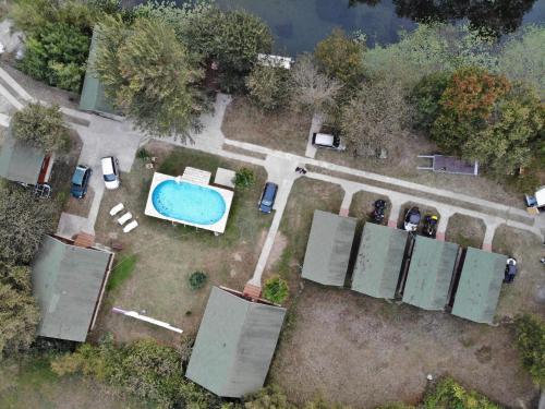 an aerial view of a yard with a swimming pool at Wooden Village Resort in Ponari