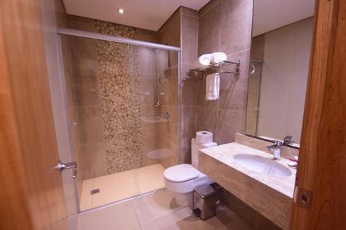 Um banheiro em Hotel Le Pelican