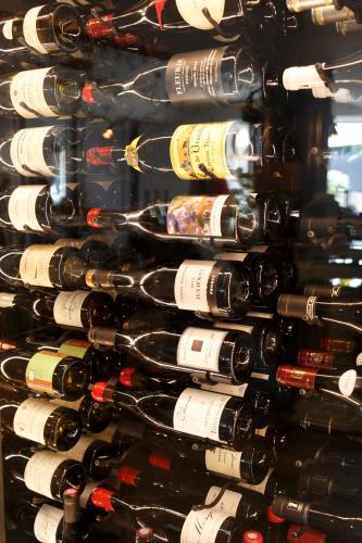 a wall of wine bottles in a wine cellar at Auberge Du Paradis in Saint-Amour-Bellevue