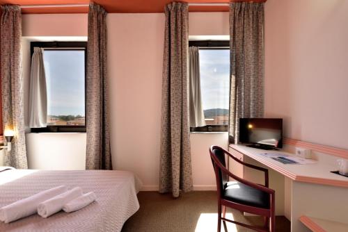 Postel nebo postele na pokoji v ubytování Hotel Orri