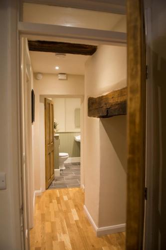 a hallway with a hallway leading to a bathroom at 138a Old Star & Garter in Ludlow
