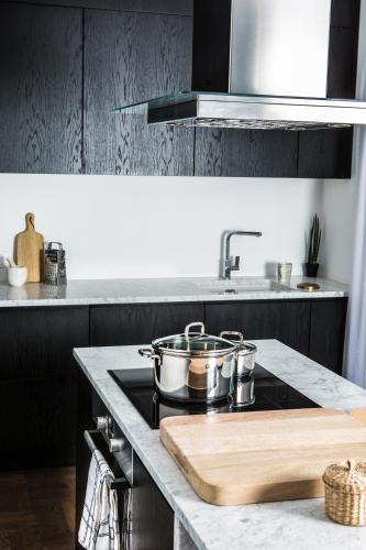 a kitchen with pots and pans on a stove at Terreno Suites in Palma de Mallorca
