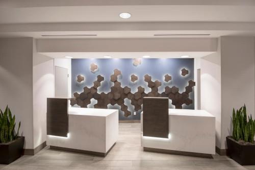 a lobby of a building with a wall covered in art at Hyatt Place Keystone - Dillon in Keystone