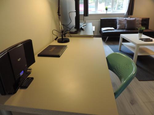 a desk with a computer on top of it at 5 Bed Camberley Airport Accommodation in Camberley